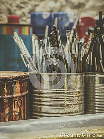 Painting accessories with brushes, cleaners and colors Stock Photo