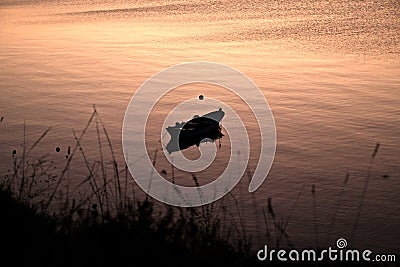 image that shows the solitude represented by a boat Stock Photo