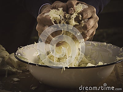 Pressing and kneading for best sauerkraut ever Stock Photo