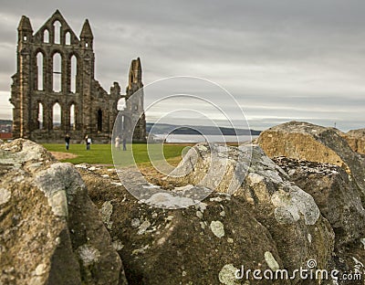 Whitby, the Abby and a stone wall. Stock Photo