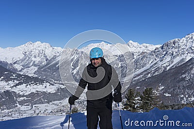 Skier ready for a ride on the top of mountain Stock Photo