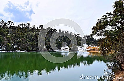 Deoria or Deoriya Tal Lake, Deodar Tree Forest, Snow and Sky - Charming Himalayan Landscape - Uttarakhand, India Stock Photo