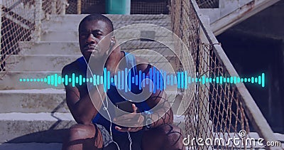 Image of soundwave over african american man on training break using earphones with smartphone Stock Photo