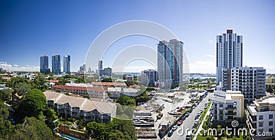 Image of a street with cars on each side and many buildings Stock Photo