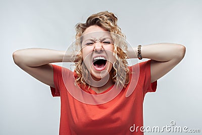 Image of stressed blonde girl grabbing her head. Problems, surprise, fear, fobia concept. Studio shot, white background Stock Photo