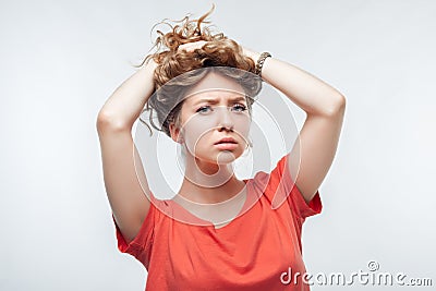 Image of stressed blonde girl grabbing her head. Problems, surprise, fear, fobia concept. Studio shot, white background Stock Photo