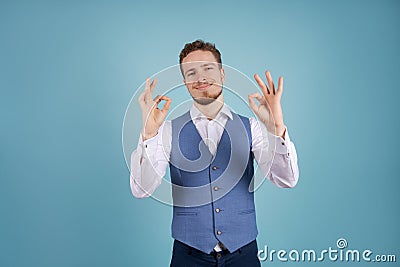 Image successful man in formal wear smiling at camera, isolated on blue Stock Photo