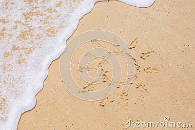Image of sun drawing on sand Stock Photo
