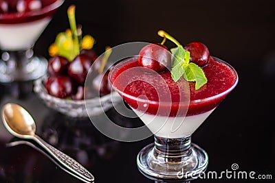 Superbly cooked panna cotta with cherry jelly in glasses Stock Photo