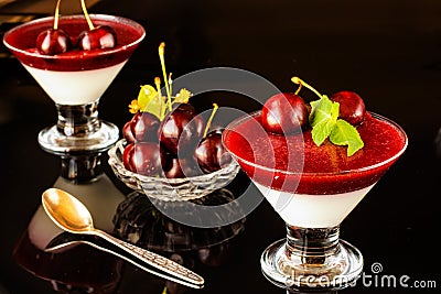 Superbly cooked panna cotta with cherry jelly in glasses Stock Photo