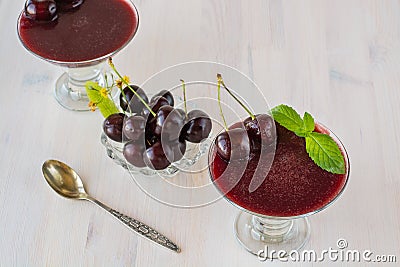 Superbly cooked panna cotta with cherry jelly in glasses Stock Photo