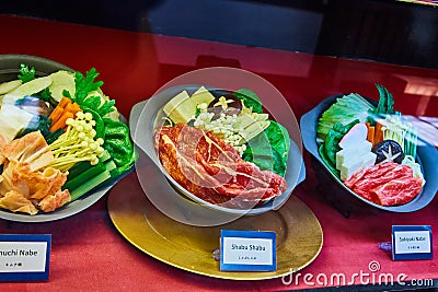 Three different Japanese meal entrees in display with toy food items Stock Photo