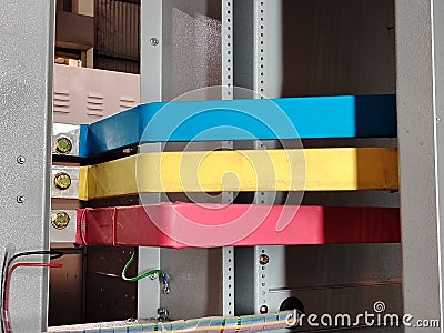 Image of three phase copper busbar connection in low voltage switchboard. Stock Photo