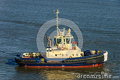 Tug Boat moving through the water Editorial Stock Photo