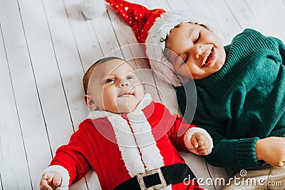 Image of two funny boys wearing christmas outfit Stock Photo