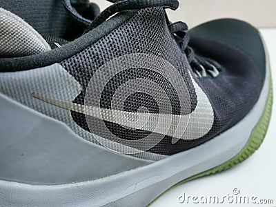 Image of used running shoe by Nike. Editorial Stock Photo