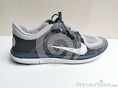 Image of used running shoe by Nike. Editorial Stock Photo