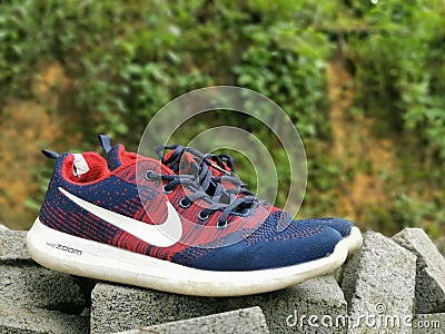 Image of used running shoes by Nike. Editorial Stock Photo