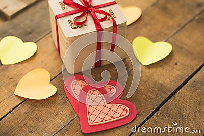 Image of Valentine`s day, symbols of love, gift box on a background of wooden planks. 2 Stock Photo