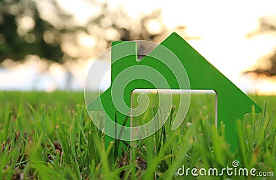 Image of vintage house in the grass, garden or park at sunset light. Stock Photo