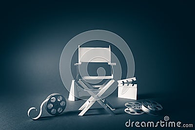 Image with vintage texture of a Director chair and movie items Stock Photo