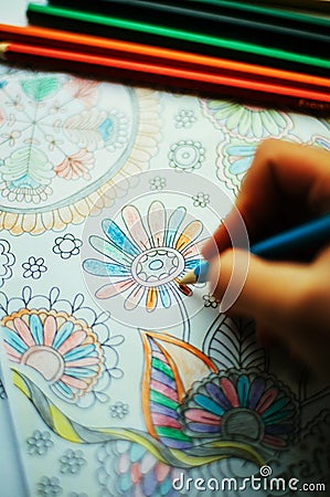 Image of woman coloring, adult coloring book trend, for stress r Stock Photo