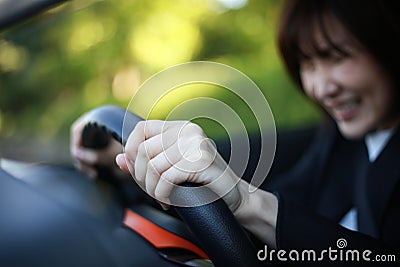 A woman who steps on a sudden brake Stock Photo