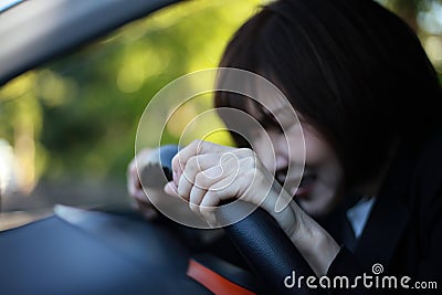 A woman who steps on a sudden brake Stock Photo