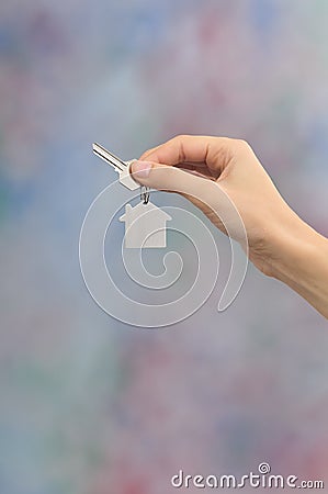 Image of a womans hand holding a key Stock Photo