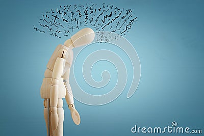 image of wooden dummy with worried stressed thoughts. depression, obsessive compulsive, adhd, anxiety disorders concept. Stock Photo