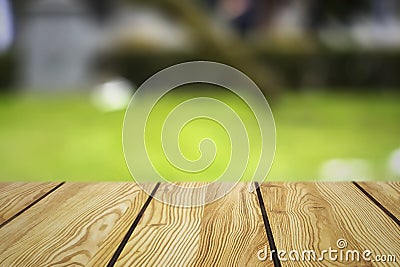 Image of wooden table in front of abstract blurred background of resturant lights Stock Photo