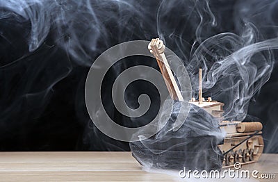 Image of wooden tank smoke dark background Stock Photo
