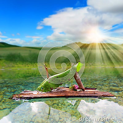 Imaginative little sail boat in a mountain lake Stock Photo