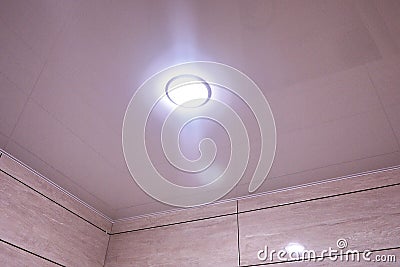 Suspended ceiling installed in the apartment or in another room with built-in lamps. Stock Photo