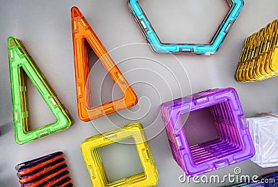 Bright geometric shapes on a magnetic base. Of these figures, the designer can assemble the various models. Perfect for the develo Stock Photo