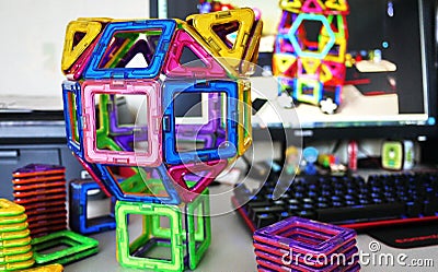 Bright geometric shapes on a magnetic base. Of these figures, the designer can assemble the various . Perfect for the develo Stock Photo