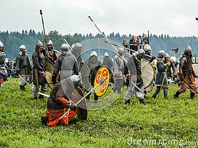 Imitation battles of the ancient Slavs during the festival of historical clubs in the Kaluga region of Russia. Editorial Stock Photo