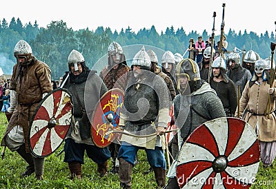 Imitation battles of the ancient Slavs during the festival of historical clubs in the Kaluga region of Russia. Editorial Stock Photo