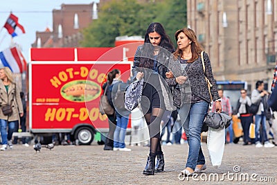 Immigrant mother and daughter on Dam Square, Amsterdam, Netherlands Editorial Stock Photo