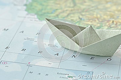 Immigration and ask for asylum concept - paper boat on map Stock Photo