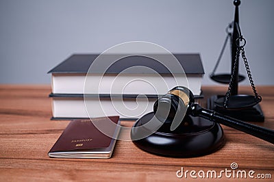 The immigration officer brought down the gavel of justice on the table, symbolizing the importance of following immigration law Stock Photo