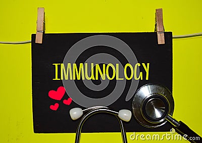 IMMUNOLOGY on top of yellow background Stock Photo