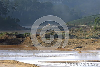 The impact of climate change, made dry land, water shortages. Lonely small house between rivers dry part 2 Stock Photo