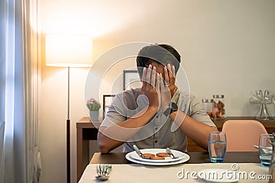 impatient muslim male waiting to break his fast Stock Photo