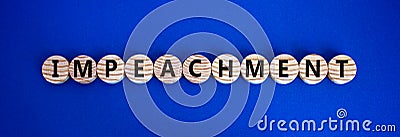 Impeachment symbol. Wooden circles with the word 'impeachment'. Stock Photo