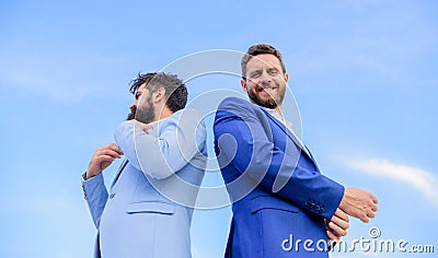 Impeccable appearance improves reputation professional entrepreneur. Perfect in every detail. Business men stand back to Stock Photo
