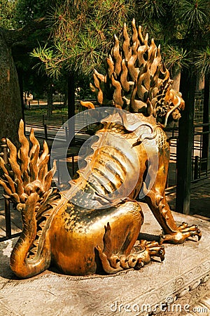 Gilded unicorn sit in the Imperial Garden of the Forbidden City. View from the back. Beijing Stock Photo