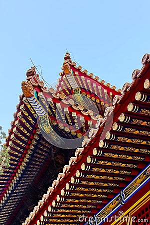 The Imperial Palace in Beijing Forbidden City. curved roofs in traditional Chinese style with figures Stock Photo