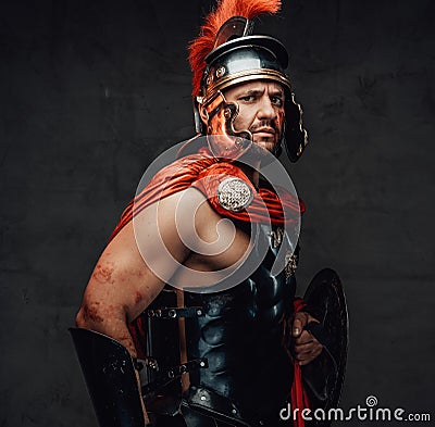 Imperial roman warrior with armour looking at camera Stock Photo