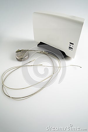 An Implantable Cardioverter Defibrillator or ICD pacemaker with leads and modem for telemonitoring at home. The device sends data Stock Photo